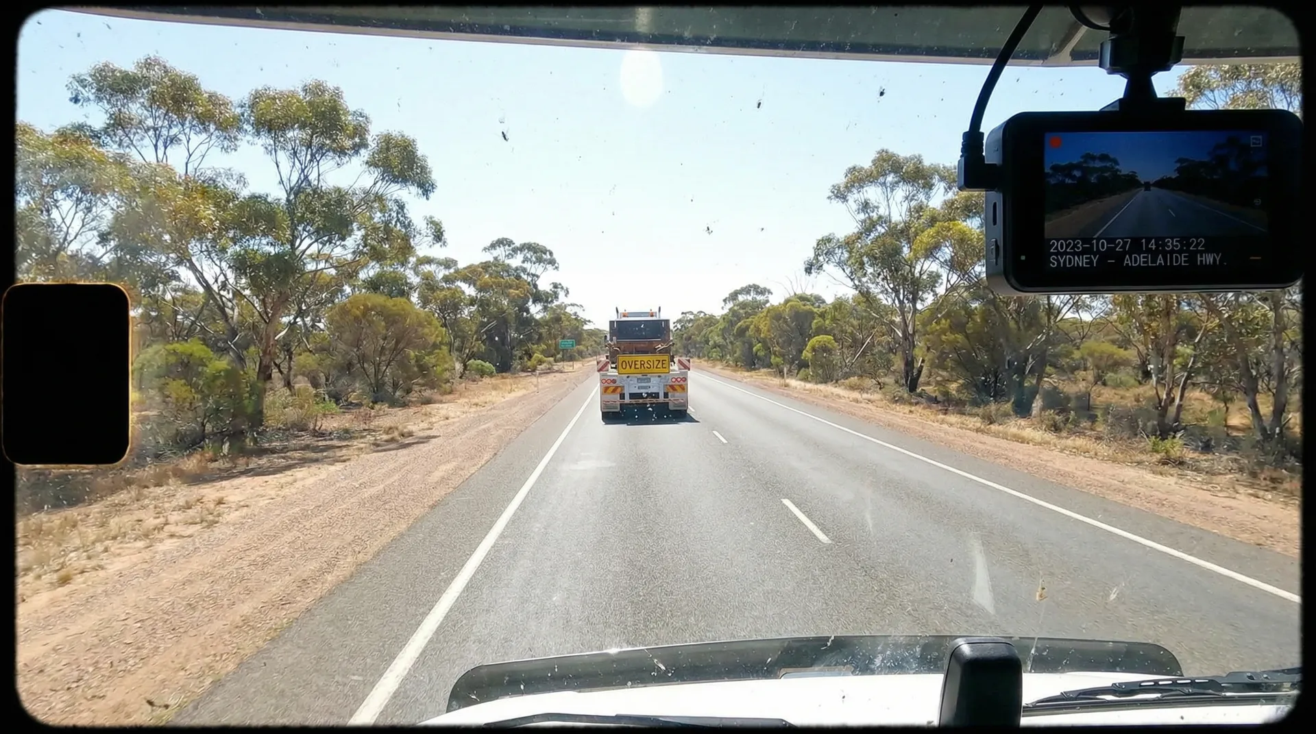 Fleet dash cam system installed in commercial vehicle capturing road and driver footage for fleet safety
