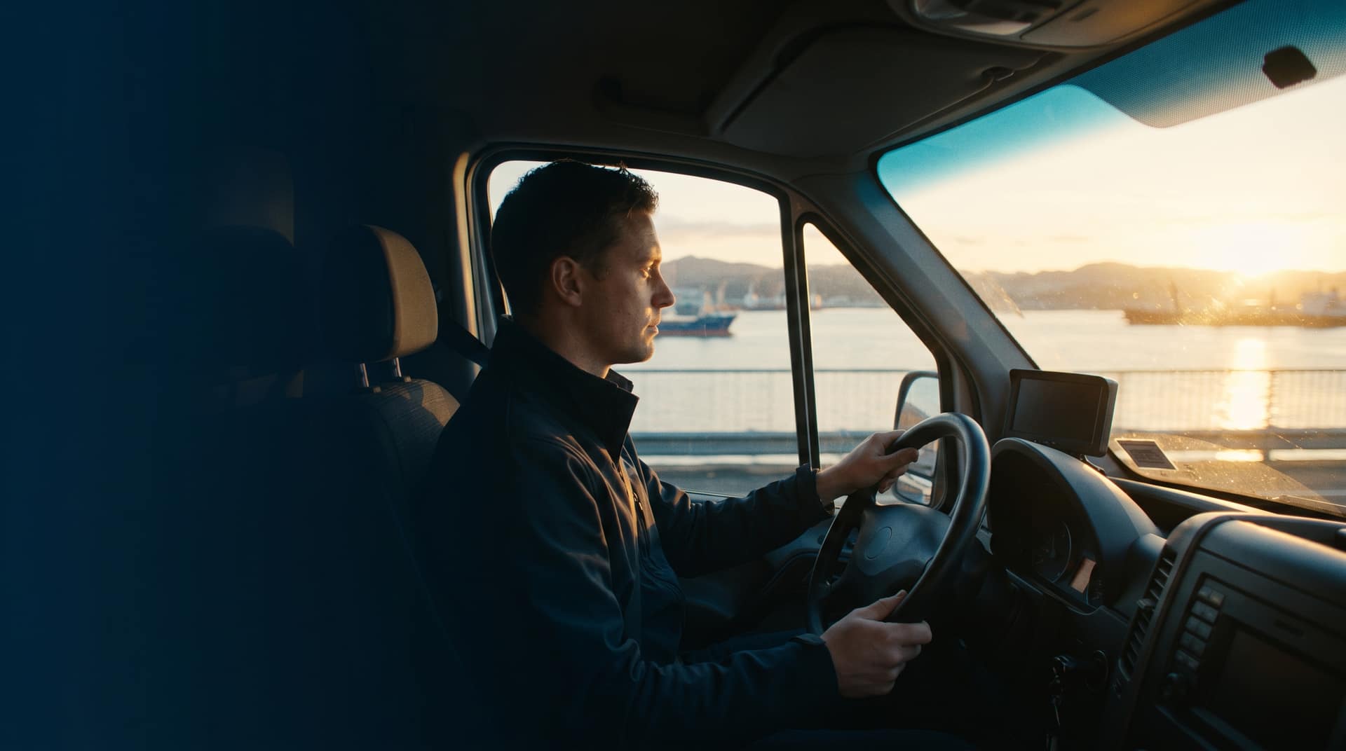 AI dashcam mounted inside a NZ truck cab monitoring driver fatigue with infrared technology on a New Zealand highway