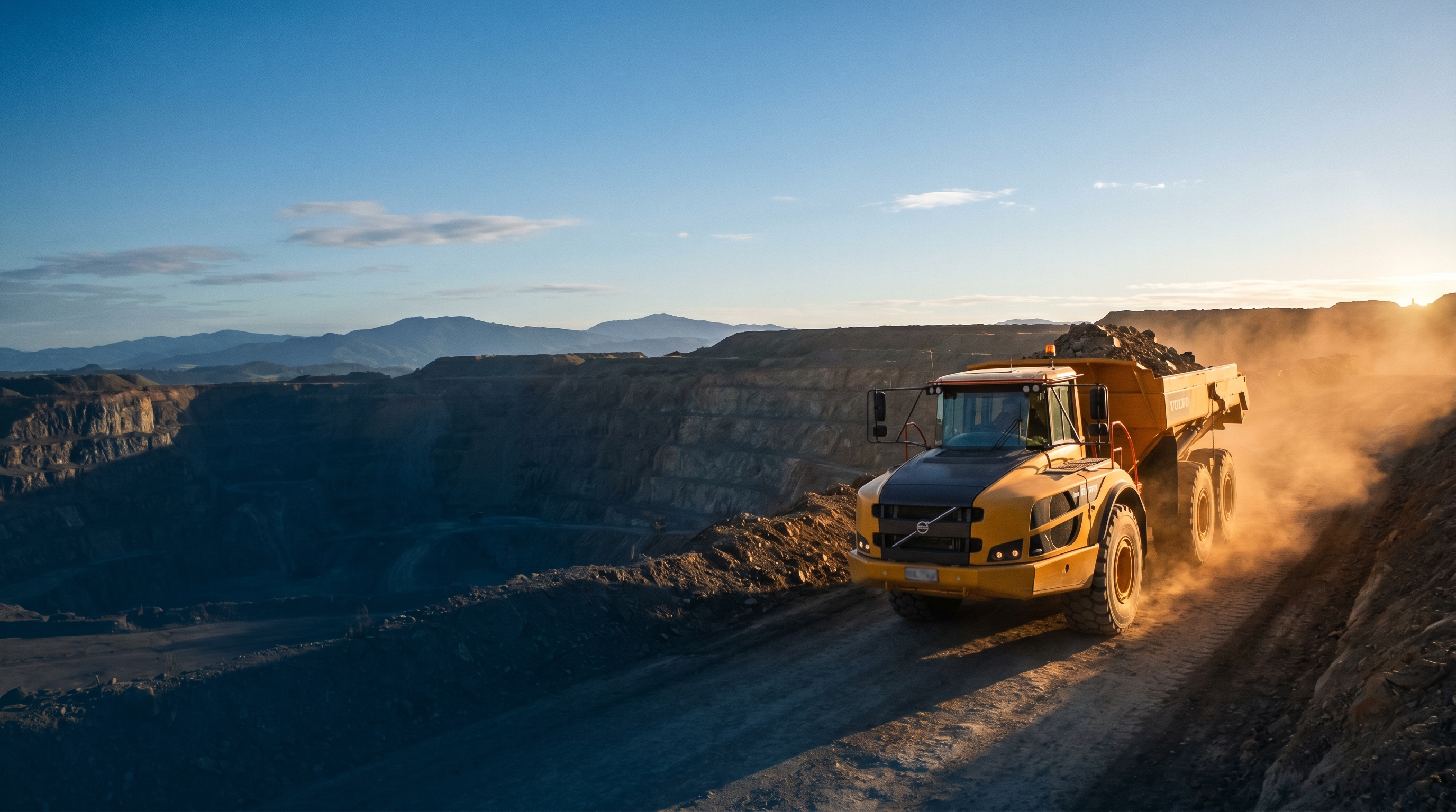 Cinematic golden hour view of NZ mining site with heavy tracked equipment on West Coast rugged terrain